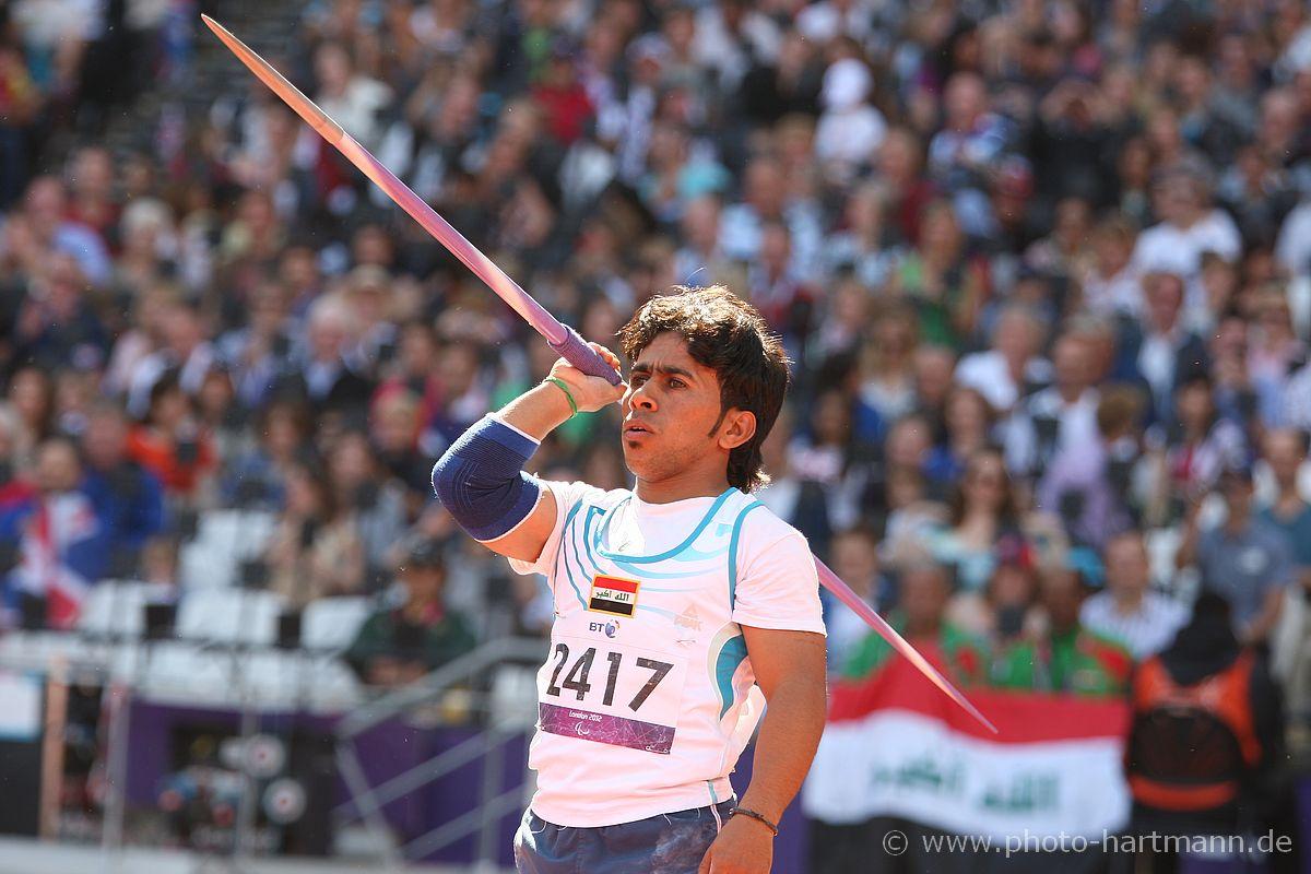 Man holds javelin and prepares to throw