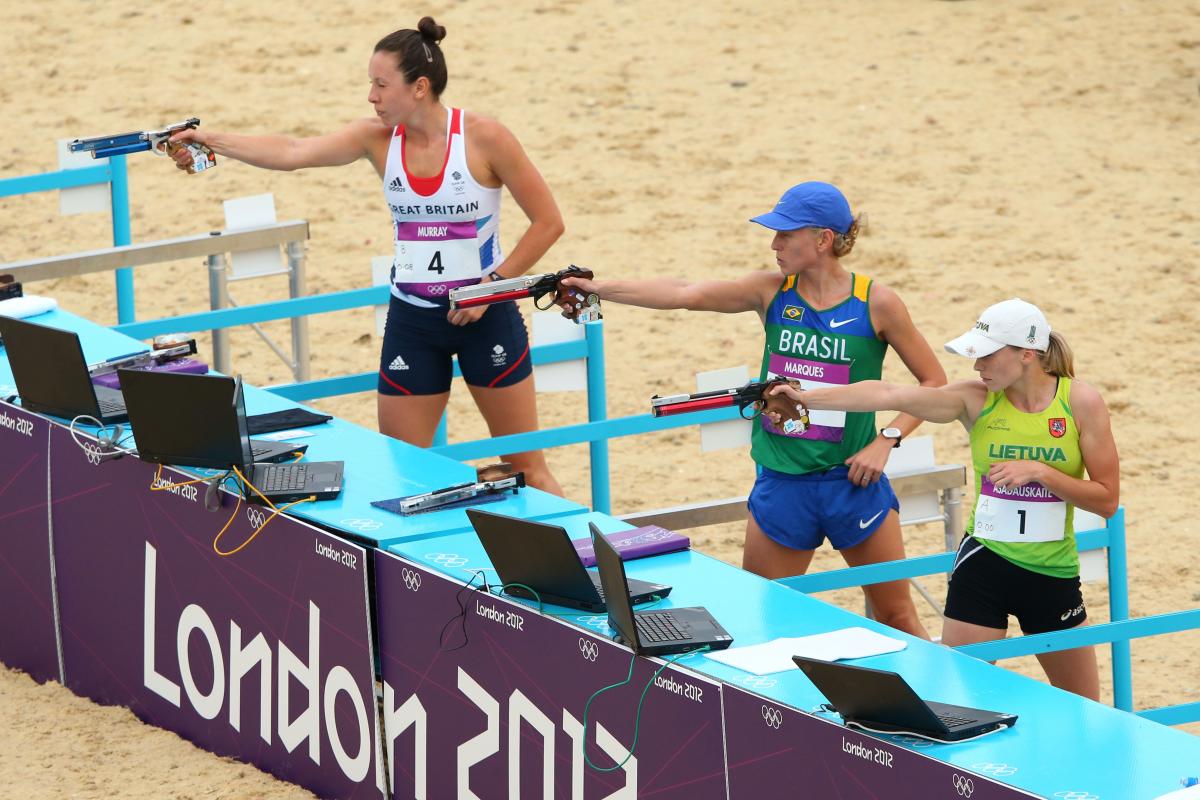 Modern Pentathlon at London 2012 Olympics Women in a shooting range with the branding "London 2012"