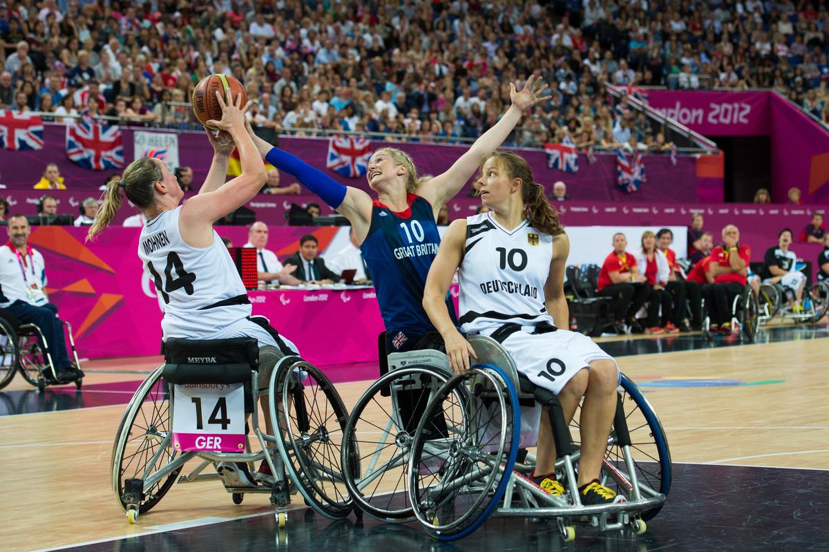 Amy CONROY, Great Britain attempts to snag the ball off Germany's Marina MOHNEN 