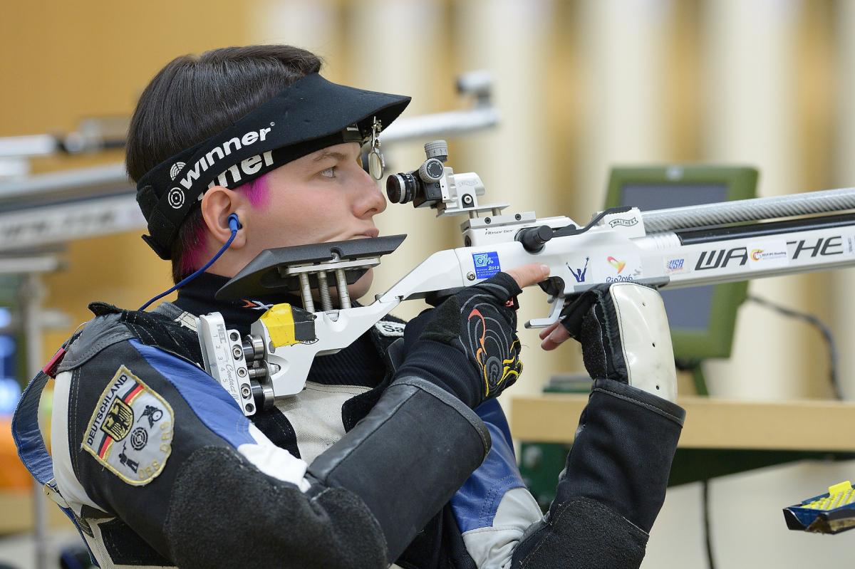 A female German shooter preparing for the next shot.
