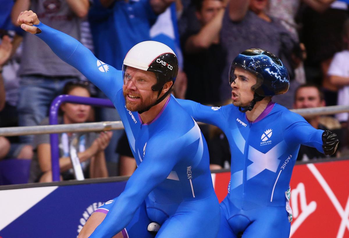 Scotland's Neil Fachie and co-pilot Craig MacLean celebrate their para-cycling victory at the Glasgow 2014 Commonwealth Games.