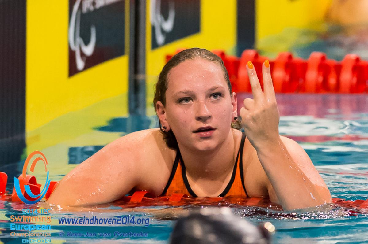 A Dutch swimmer after winning a medal at the 2014 IPC Swimming European Championships.