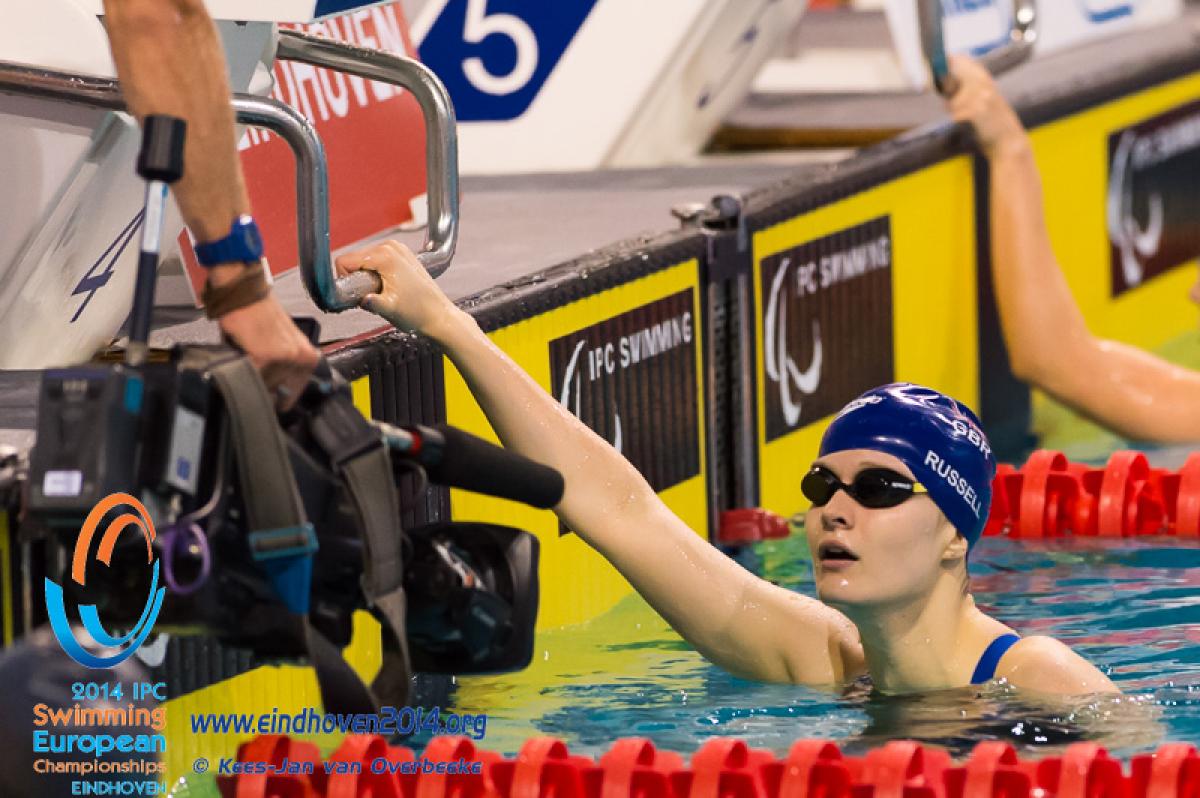 A British swimmer is filmed on completed a race a the 2014 IPC Swimming European Championships