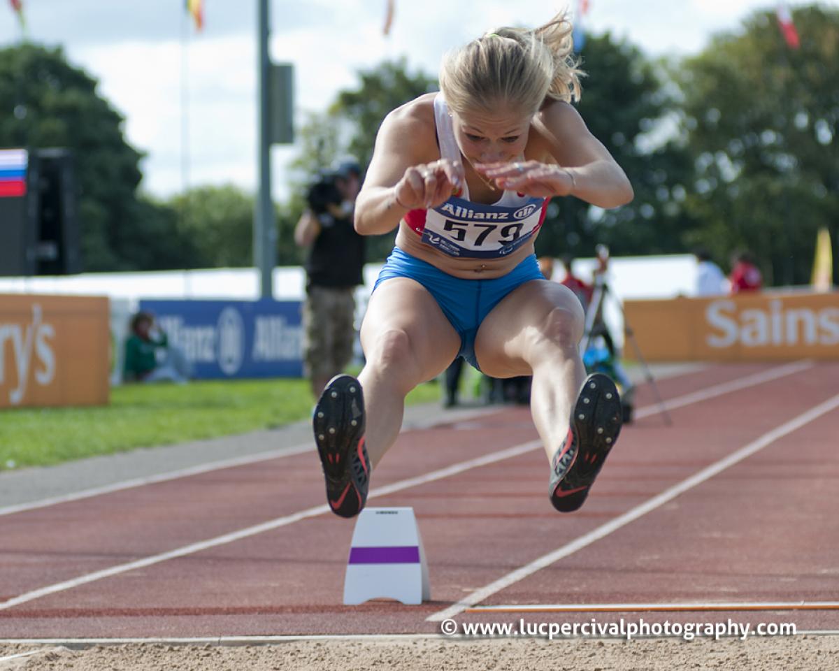 Goncharova long jump T38 Swansea 2014 Women doing long jump shortly before the landing