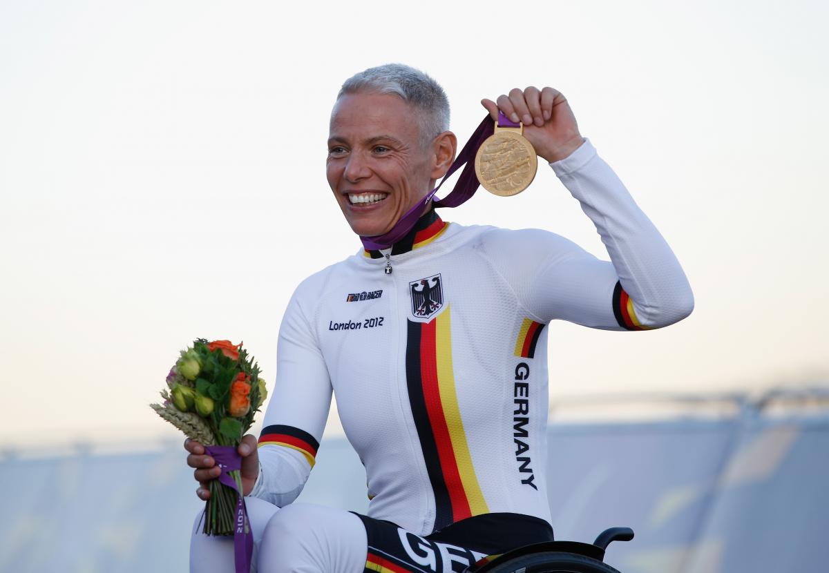 Andrea Eskau Germany's Andrea Eskau recevies her gold medal after winning the women's H4 road race at the London 2012 Paralympic Games at Brands Hatch.