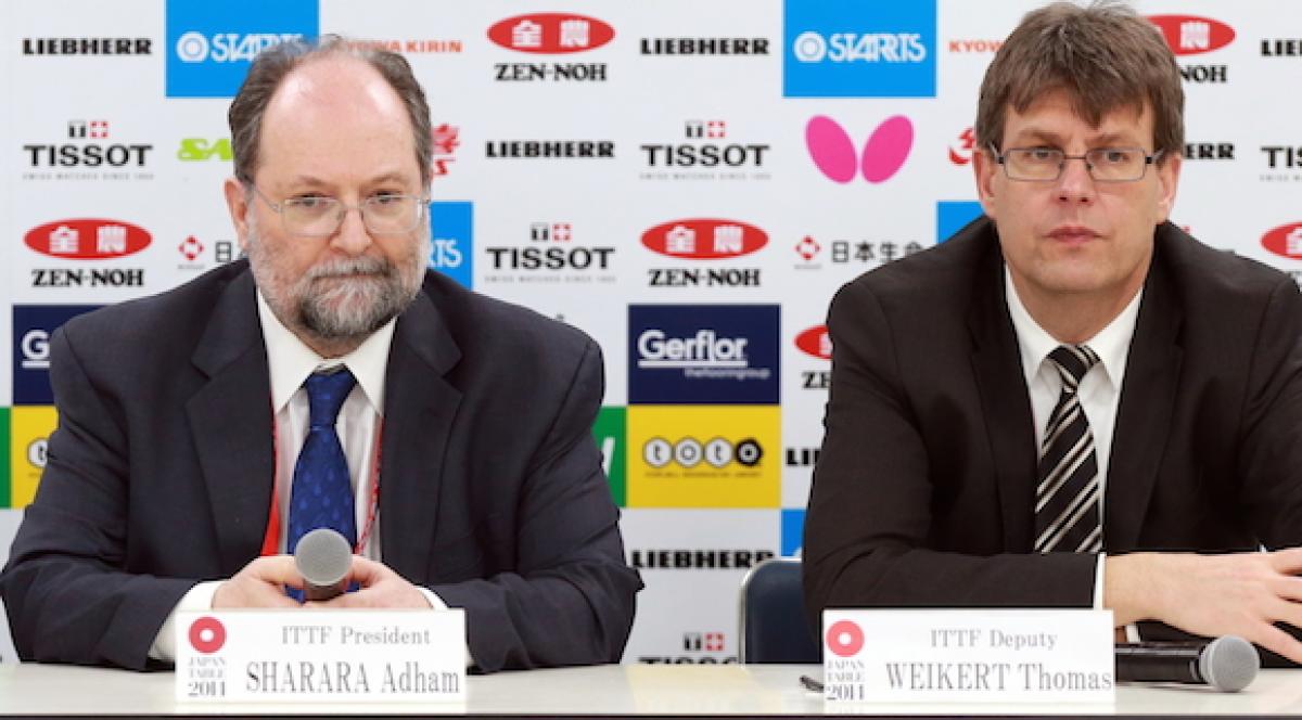 Thomas Weirkert succeeds Adham Sharara in his role as ITTF President Two men on a press conference podium.