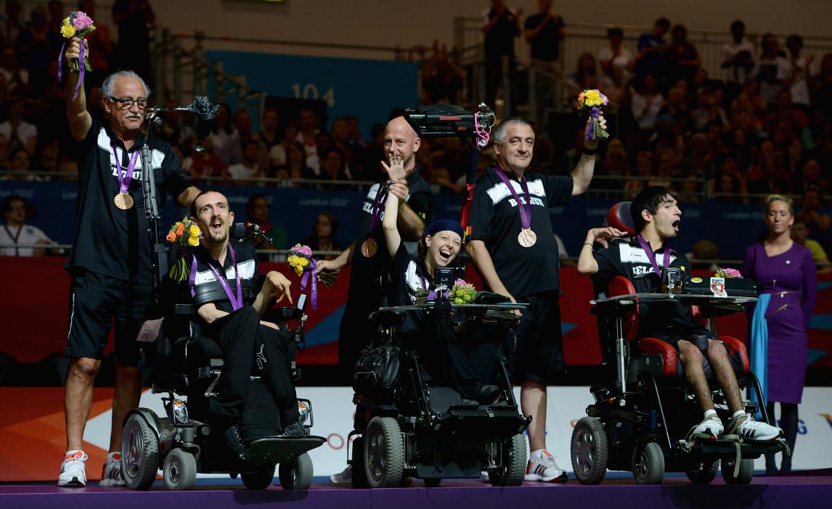 Belgium boccia Pieter Cilissen, Kirsten De Laender and Pieter Verlinden of Belgium celebrate winning bronze in the Mixed Pairs Boccia - BC3 at the London 2012 Paralympic Games.