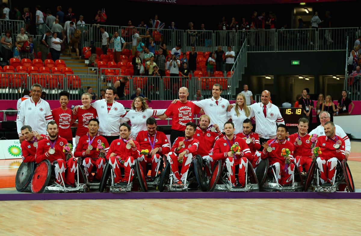 Canadian men celebrating with their medals