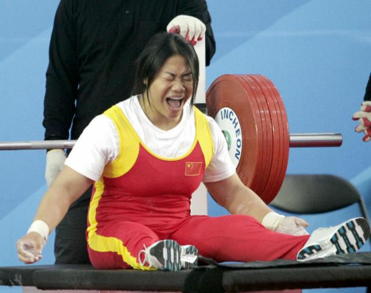 Women on bench screaming of joy