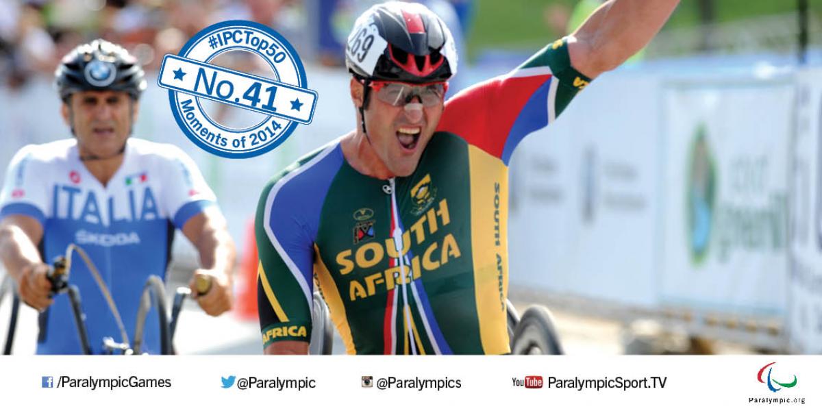 No. 41 Battle of the H5 category at the World Championships Two men in hand cycles cross the finish line one after another. The first one celebrates.
