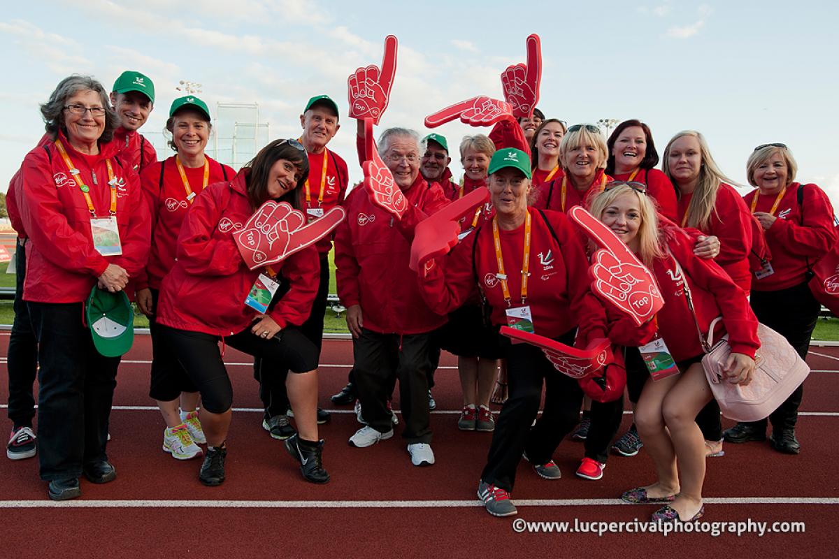 Some volunteers at the Swansea 2014 IPC Athletics World Championships pose for a photo.