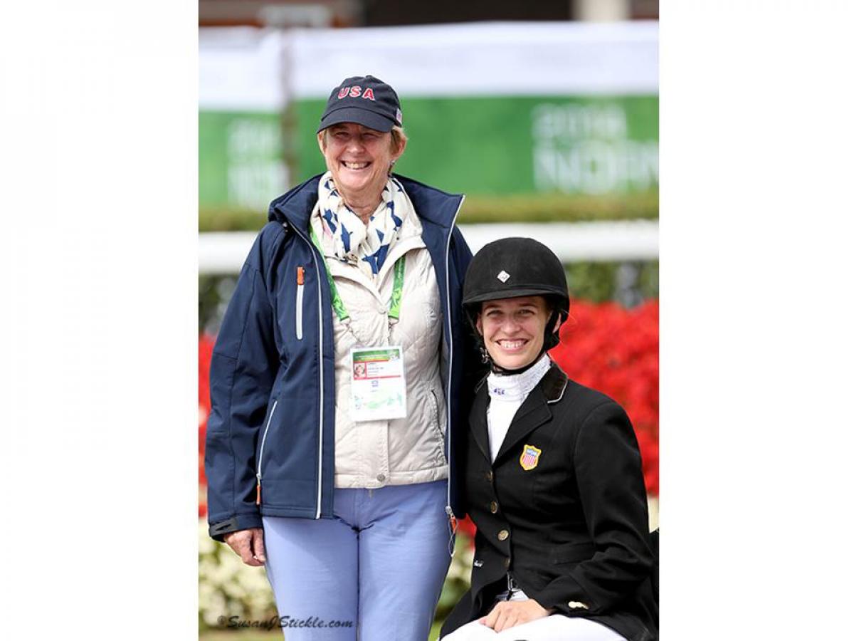 US para-equestrian fundraising Two women posing for a photo, one with riding clothes