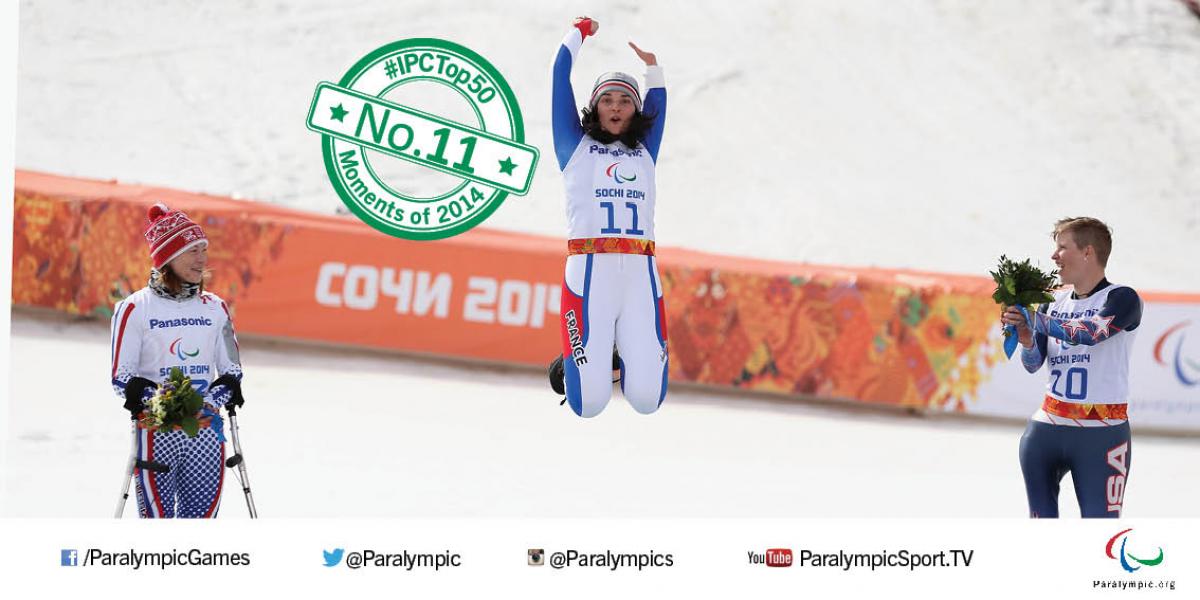 Marie Bochet jumps into the air to celebrate winning Paralympic gold at Sochi 2014.