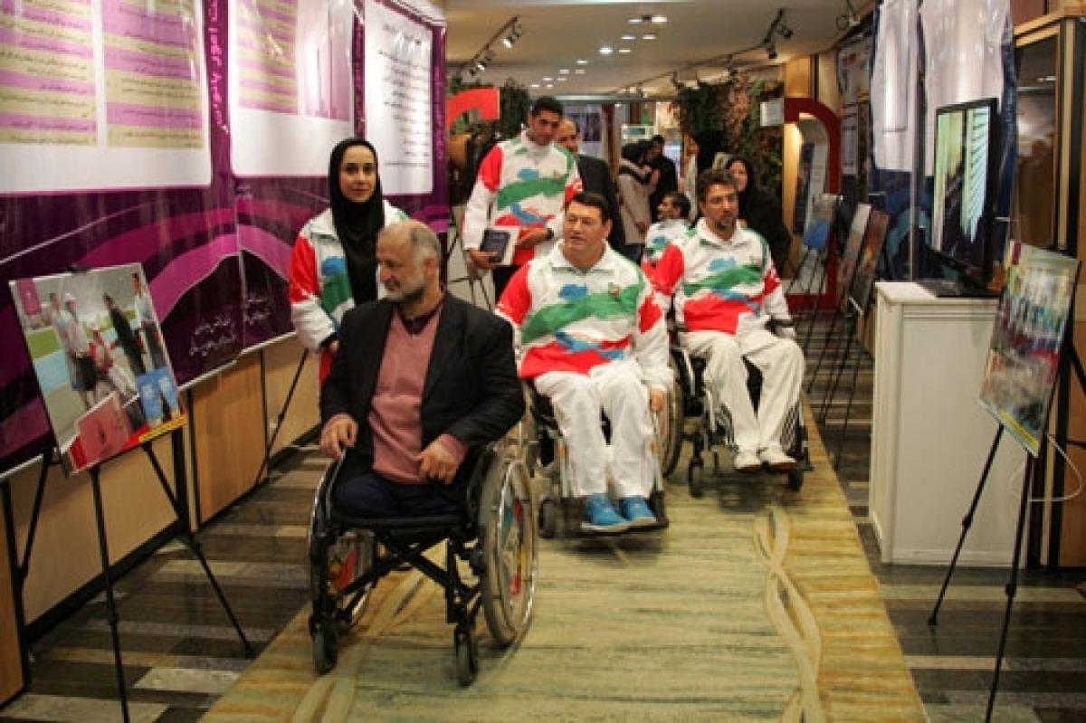 Members of the Iranian Parliament visit the NPC Iran exhibition in December 2014.
