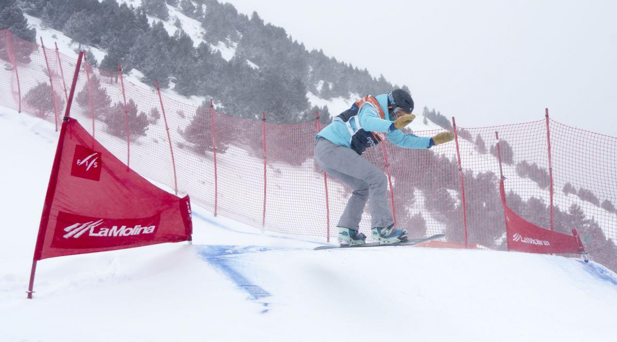 Women on snowboard on the slope