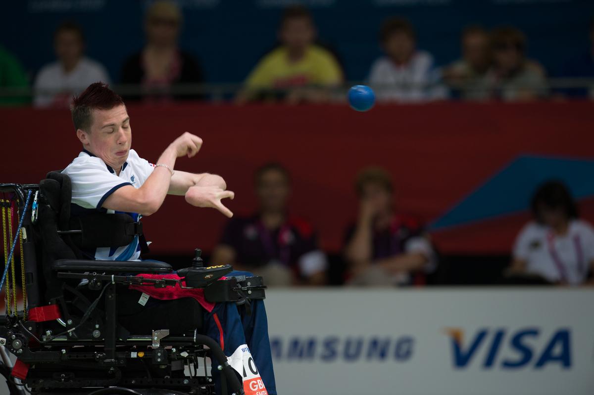 Man in wheelchair throwing a ball