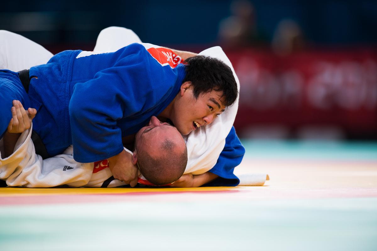 Gwang-Geun Choi of South Korea attacks during the u100kgs quarter-finals at the London 2012 Paralympic Games.