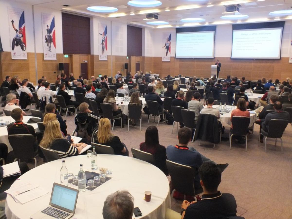 UK Paralympic Sport Science and Sport Medicine Conference 2015 Room with stage and tables around it