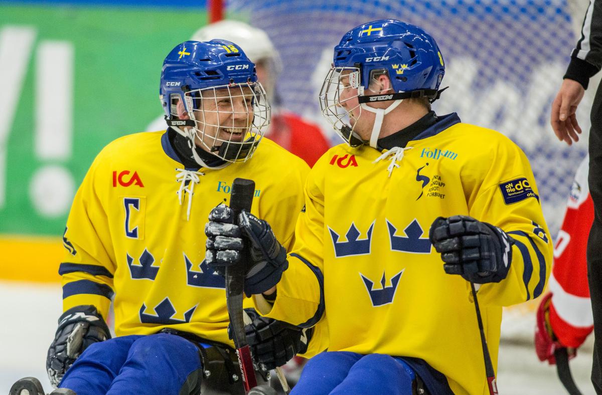 Per Kasperi celebrating with his teammate in the game against Austria at the 2015 IPC Ice Sledge Hockey World Championships B-Pool in Ostersund, Sweden.