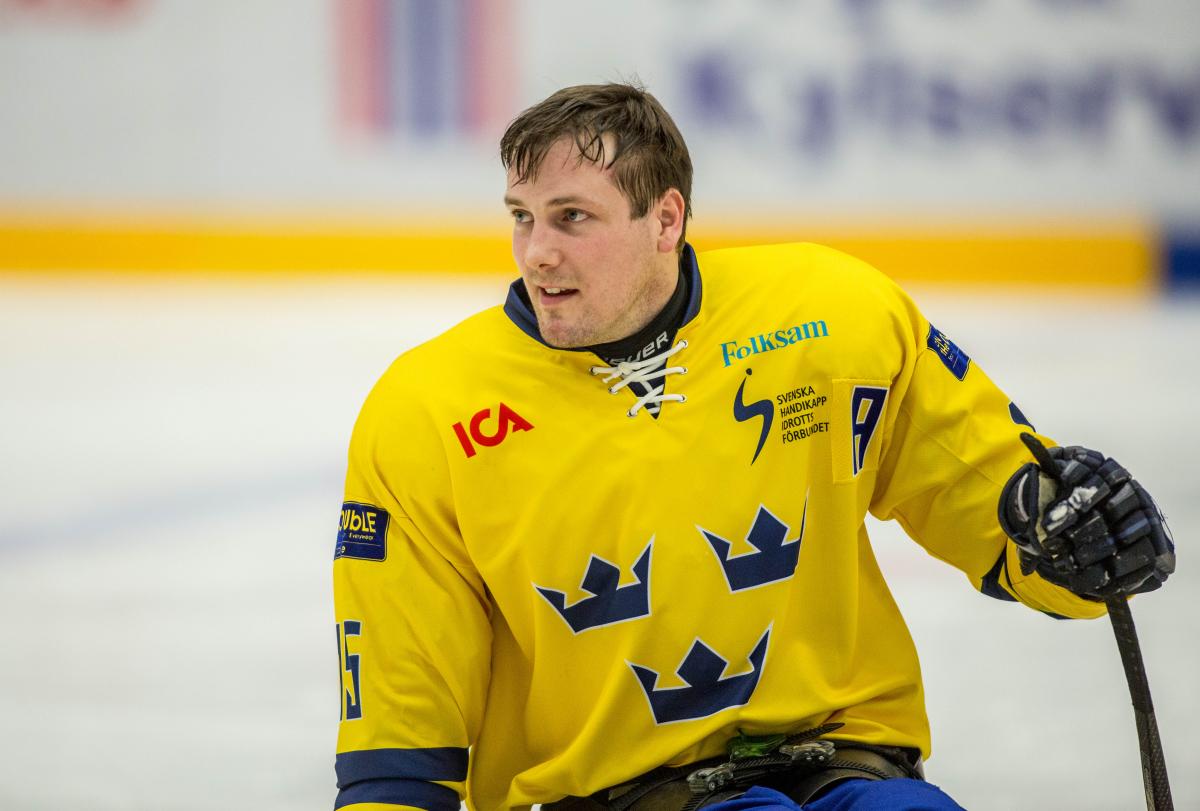 Christian Hedberg - SWE-AUT - 2015 IPC Ice Sledge Hockey World Championships B-Pool Swedish Para ice hockey player in his yellow Sweden jersey