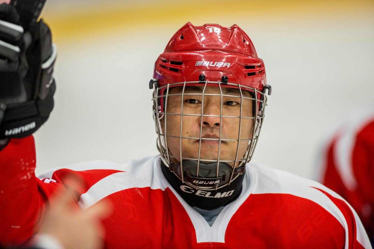 Man with helmet and red jersey