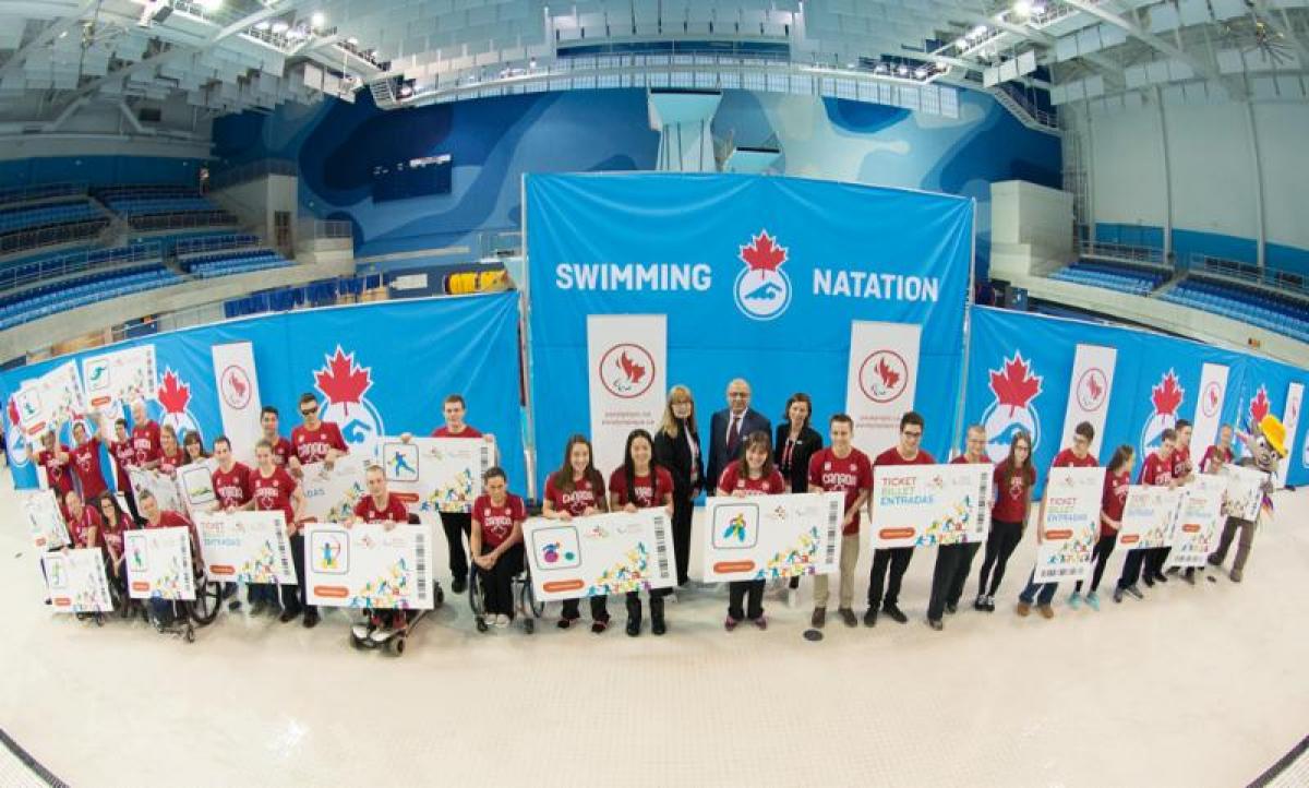 Canadian swimming team for Toronto 2015 Group shot of athletes and officials in a swim stadium