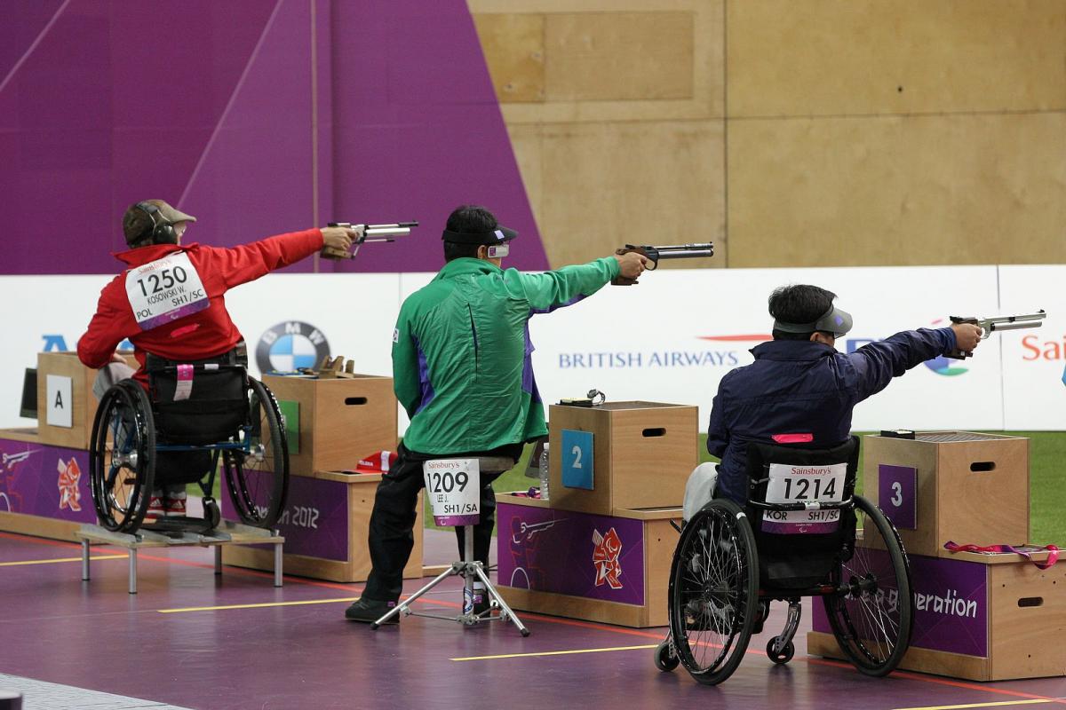 Wojciech Kosowski - Shooting - London 2012 Paralympic Games Three athletes shooting in a range