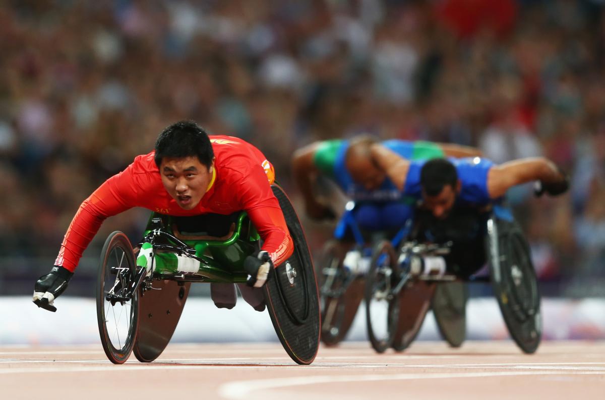 Huzhao Li of China Huzhao Li of China crosses the line to win gold in the Men's 200m T53 Final at the London 2012 Paralympic Games.
