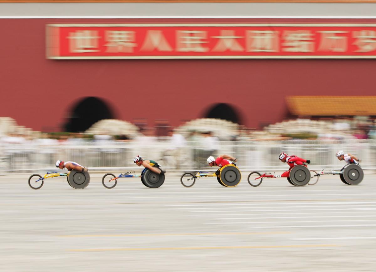 The lead group of the marathon goes past the Forbidden City at Tiananmen Square at the Beijing 2008 Paralympic Games. 