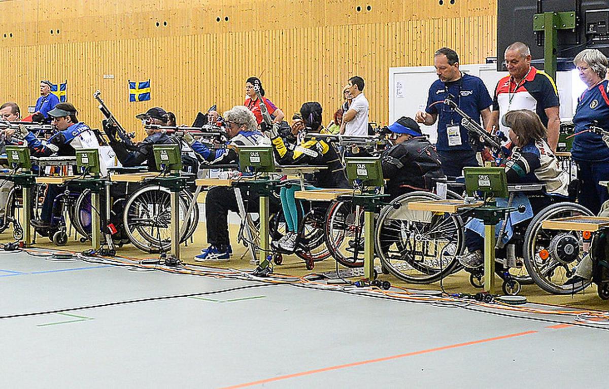 Shooters take aim during rifle competitions at the 2014 IPC Shooting World Championships