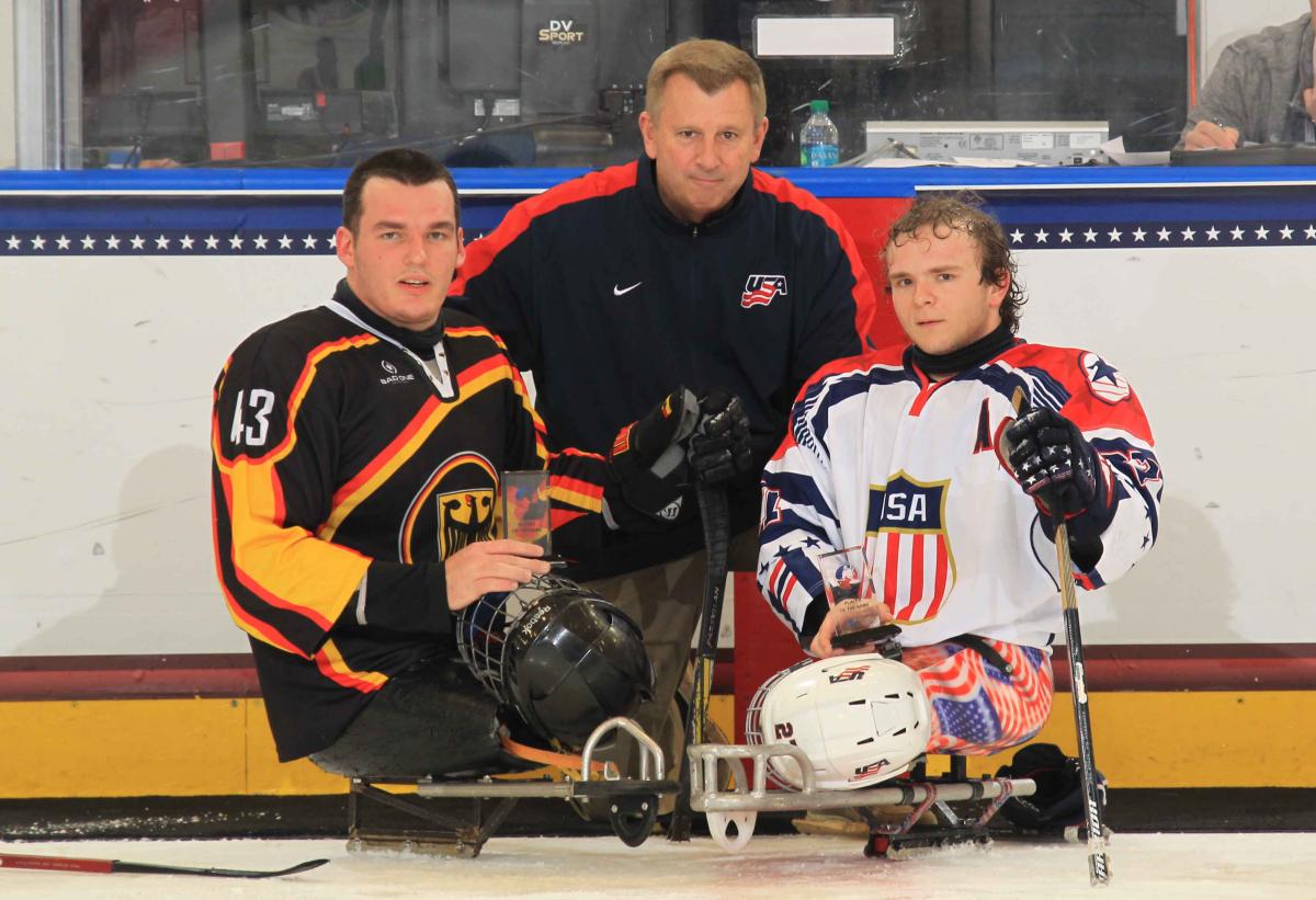 Best players of the preliminary game, Joshua Pauls, USA, and Bernhard Hering, Germany, at the 2015 IPC Ice Sledge Hockey World Championships A-Pool Buffalo.
