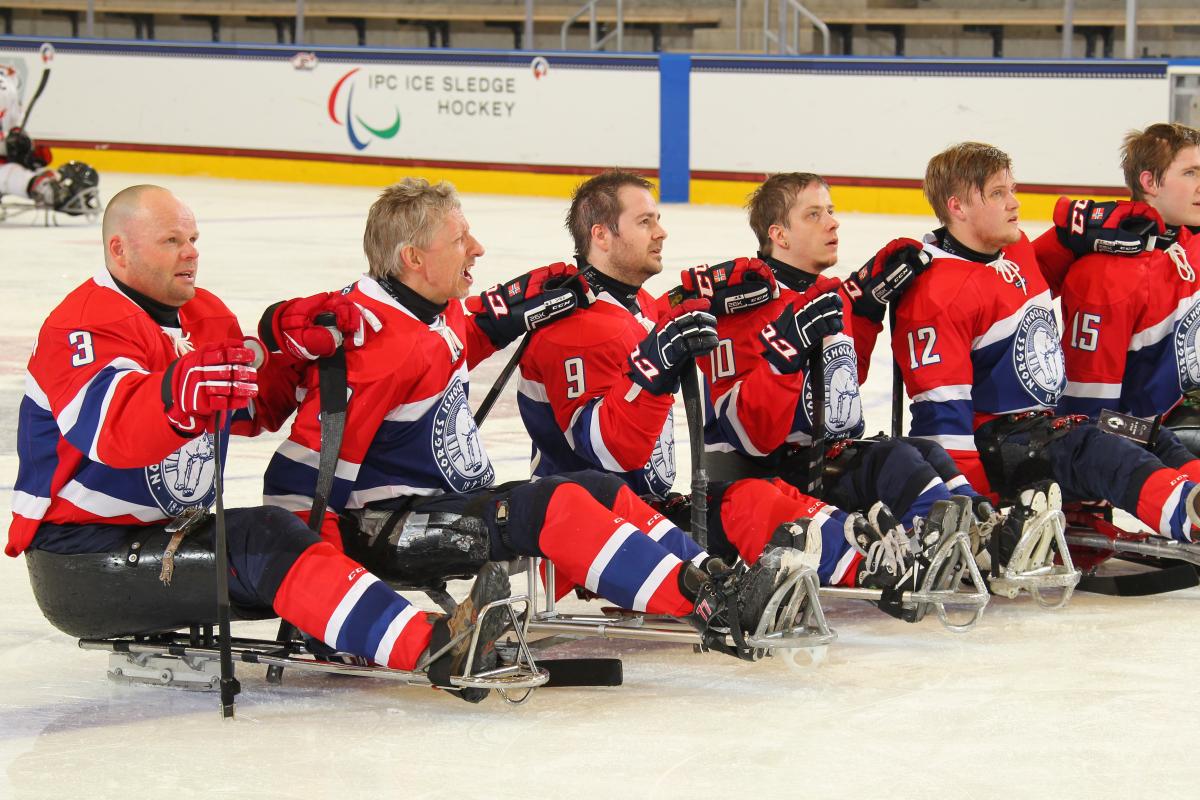 Team Norway - Norway v Japan - 2015 IPC Ice Sledge Hockey World Championships Norway's team listens to their national anthem after defeating Japan in their final prelminary round game at Buffalo 2015.