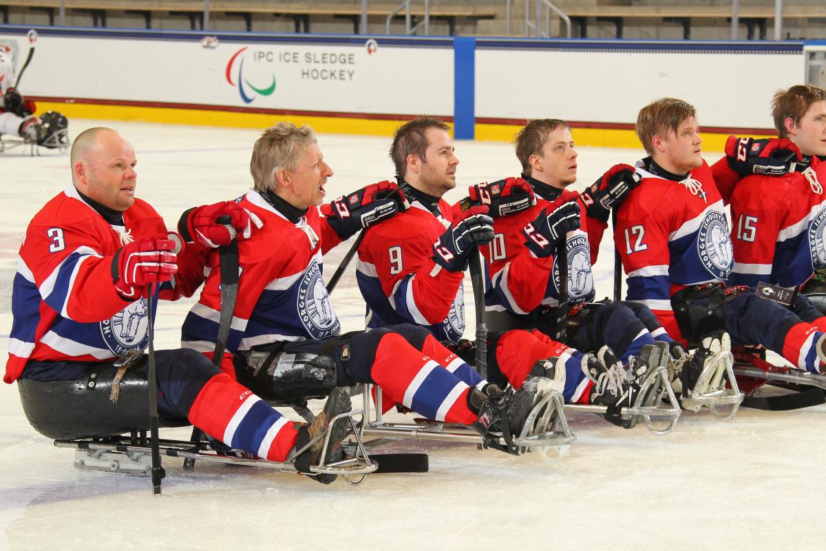 Norway's team listens to their national anthem after defeating Japan in their final prelminary round game at Buffalo 2015.