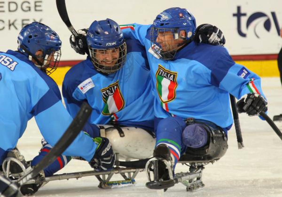 Italy's players celebrate after winning their playoff game at Buffalo 2015.