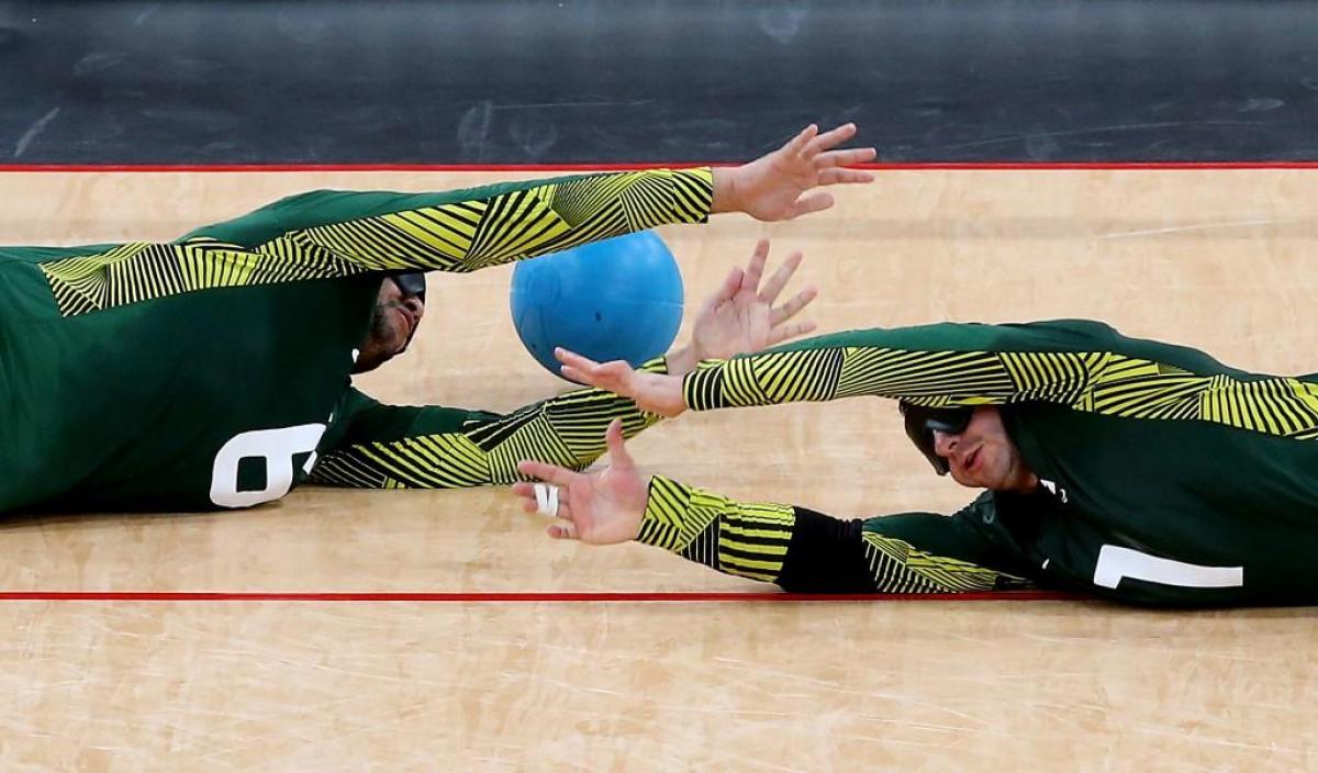 Jose Roberto Ferreira de Oliveira (R) and Romario Diego Marques of Brazil fail to stop a goal during the Men's Group A Goalball match between Finland and Brazil at the London 2012 Paralympic Games. 