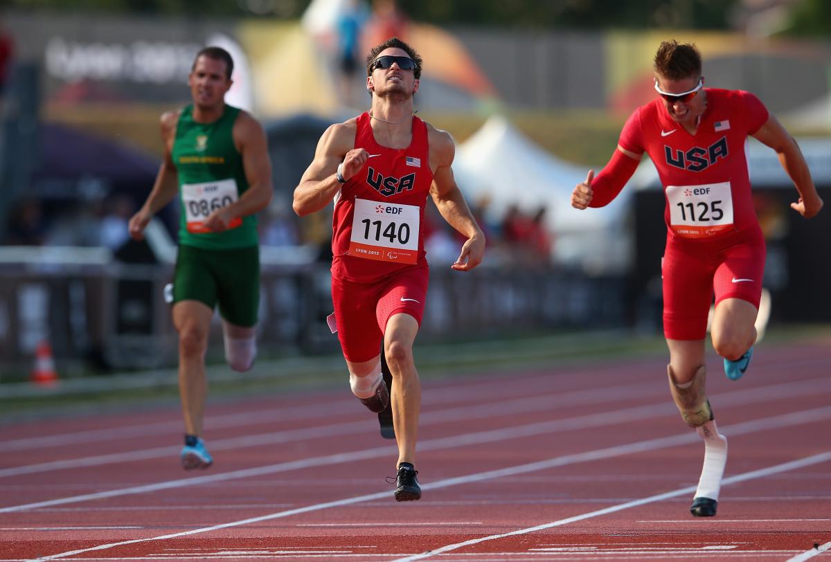 US sprinter Jarryd Wallace wins the men's 200m T44 World Championships race.