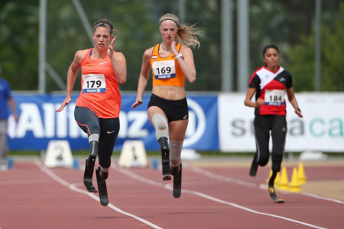 A sprinter overtakes another runner on the 100m straight.