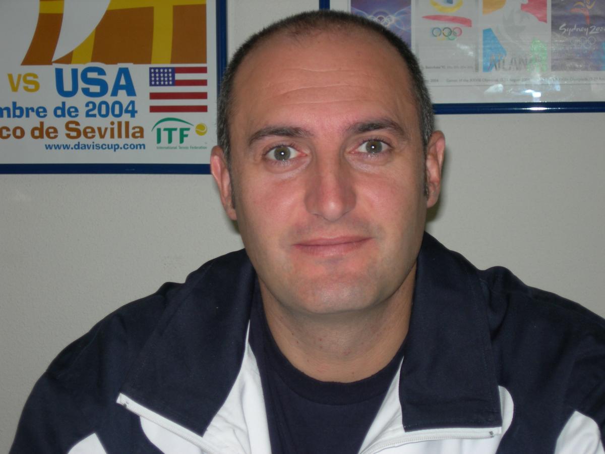 Portrait photo of a dark haired man