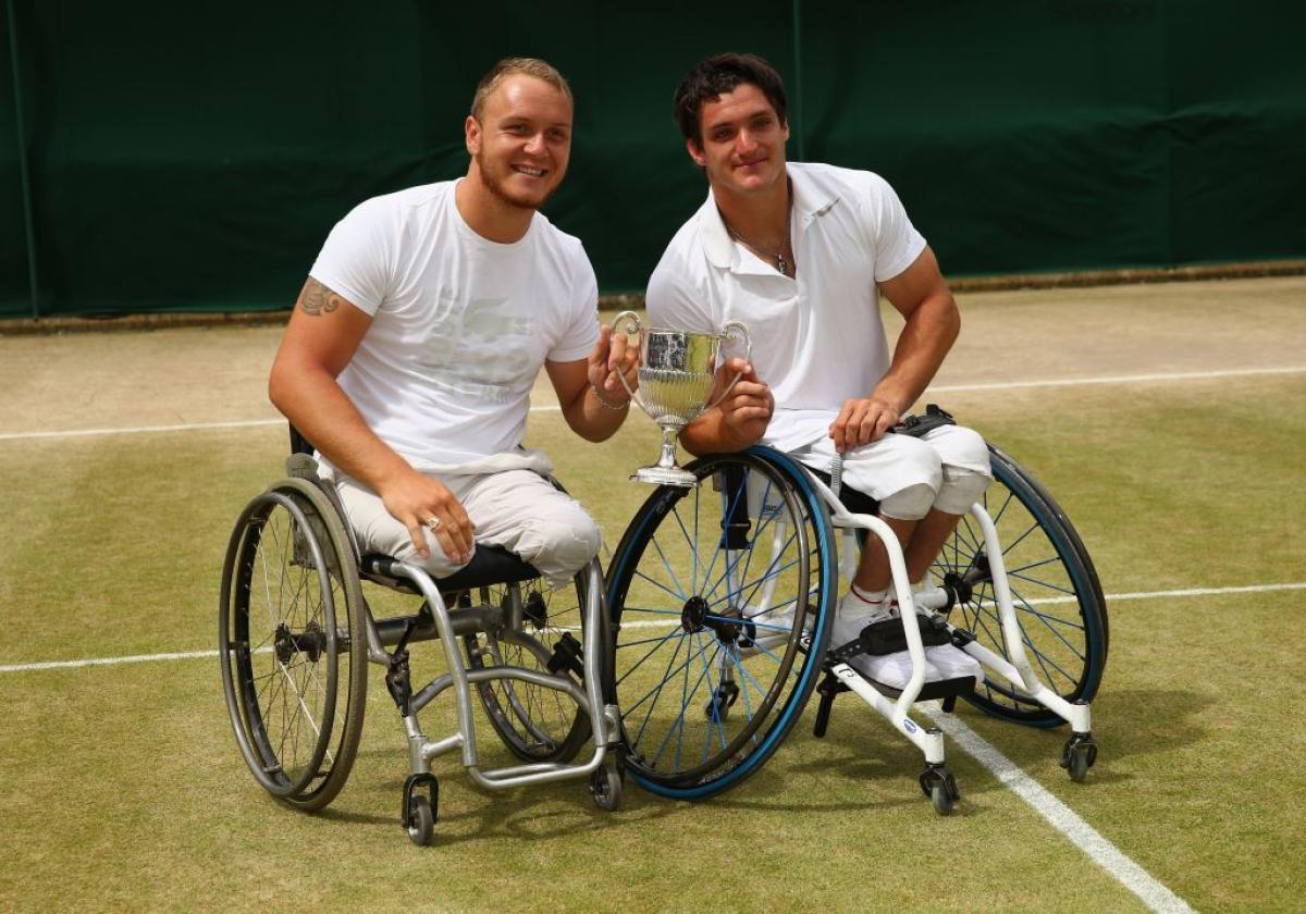 Nicolas Peifer of France and Gustavo Fernandez of Argentina pose with the winners trophy