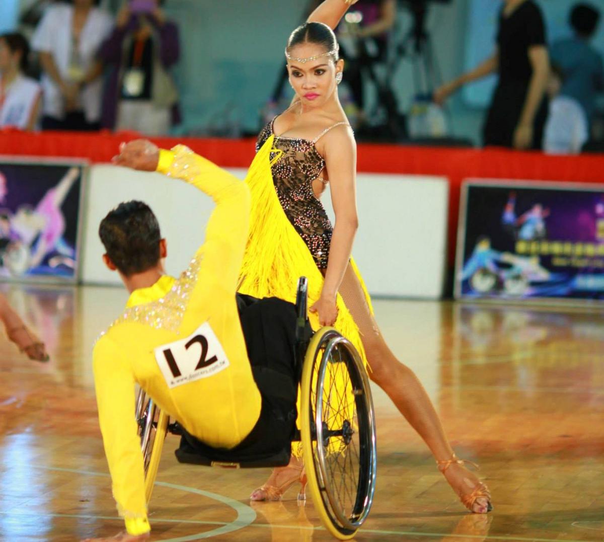 2015 IPC Wheelchair Dance Sport New Taipei City Cup Open Man in wheelchair and woman standing pose while dancing