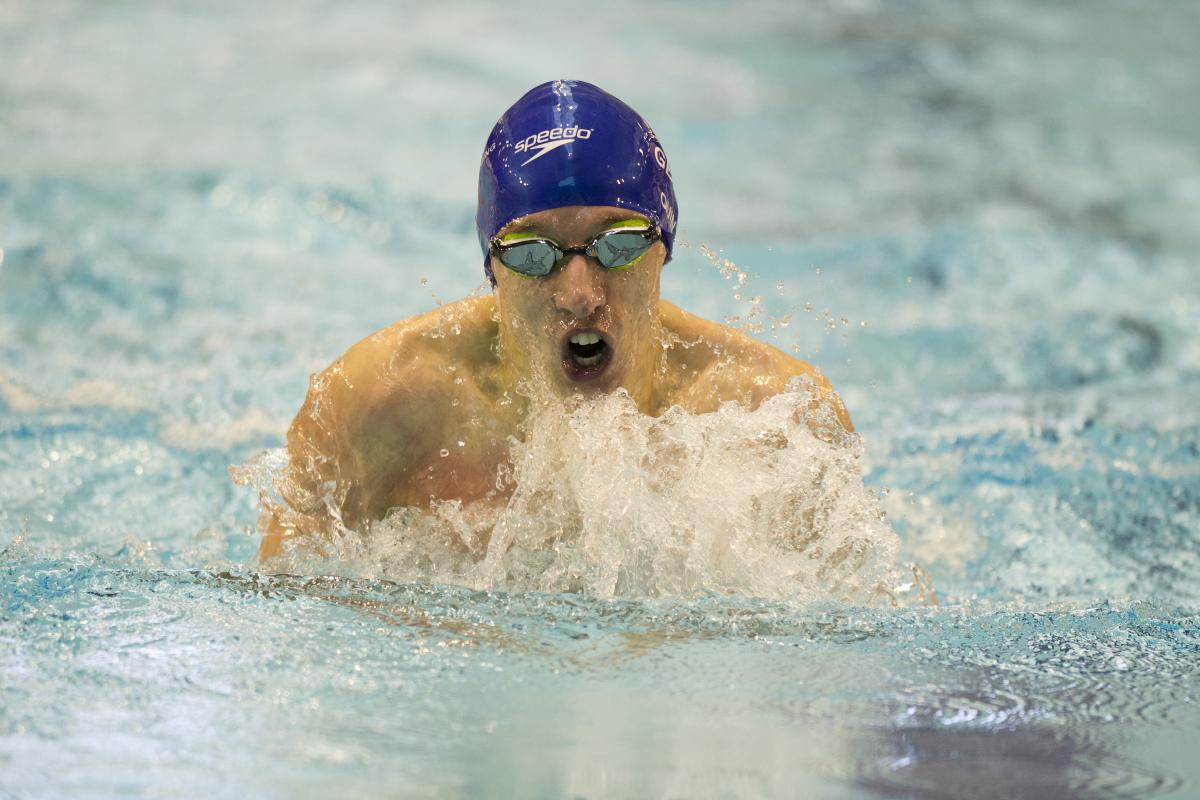 A Para swimmer competes in breaststroke