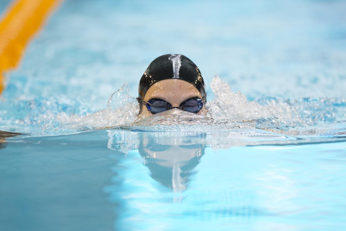 A swimmer's head rising out of the water