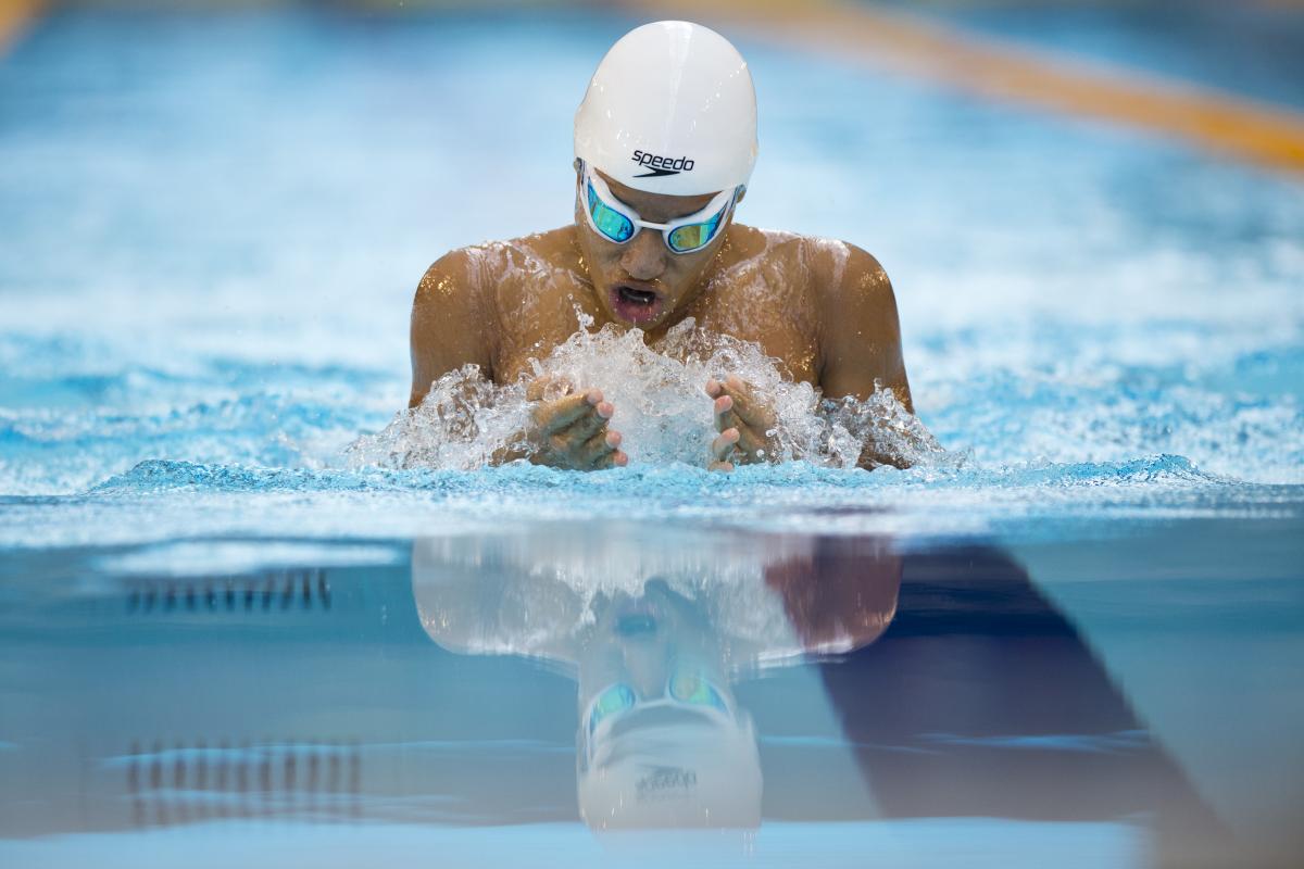 Swimmer in the water, doing breaststroke