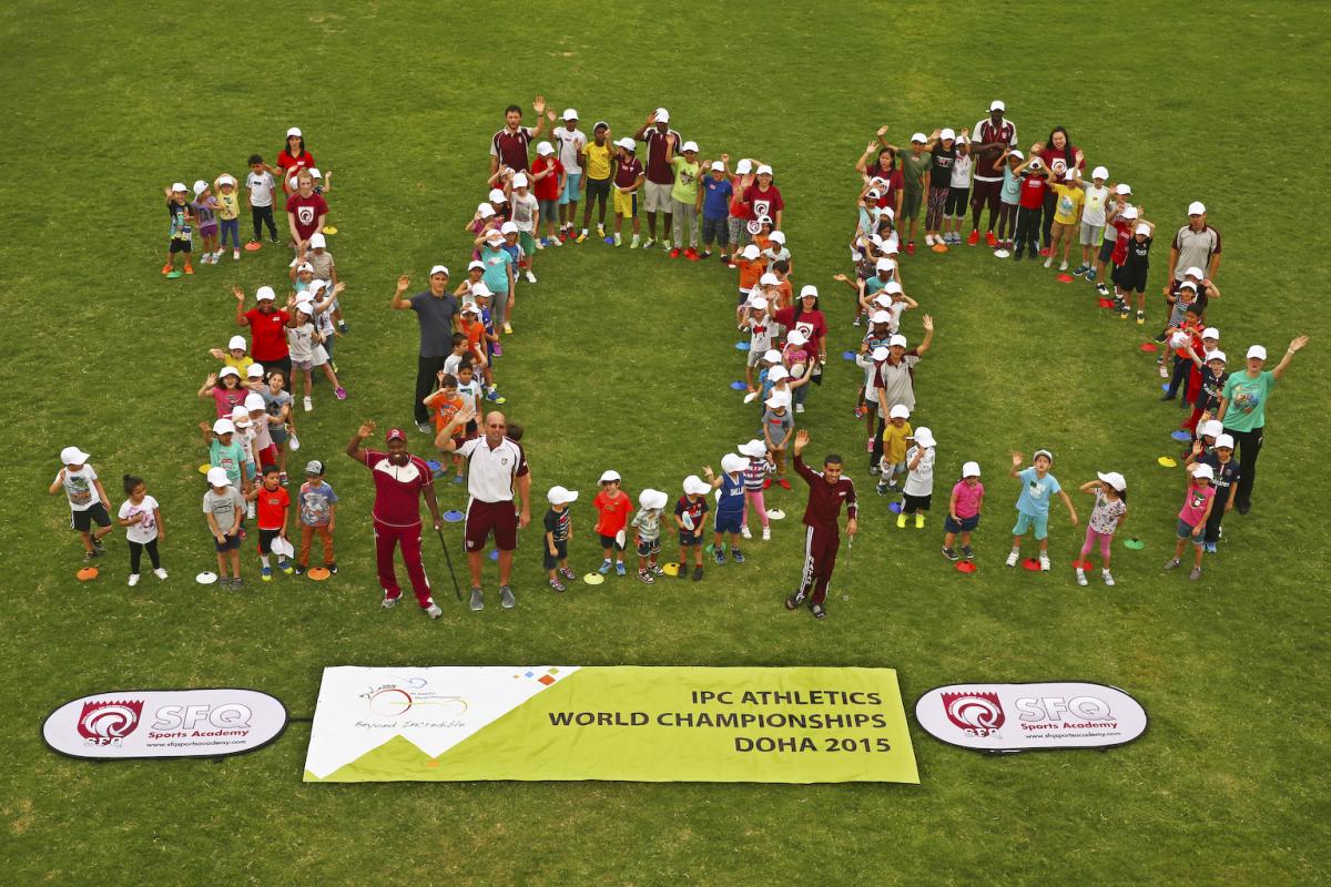 Group of people forming a 100, shot taken from above