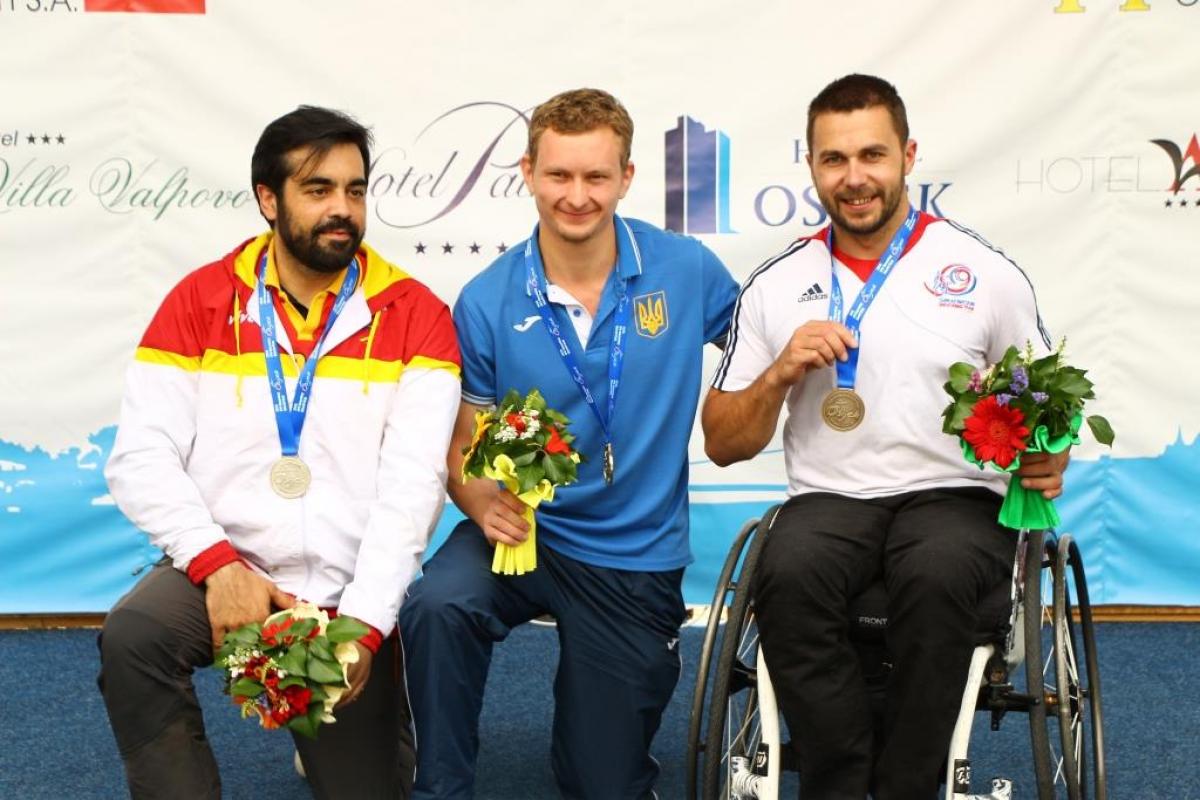 Ukraine’s Andrii Doroshenko wins gold in the R6, beating Spain’s Juan Antonio Saavedra Reinaldo and Great Britain’s Matt Skelhon at the IPC Shooting World Cup on 14 July in Osijek, Croatia.