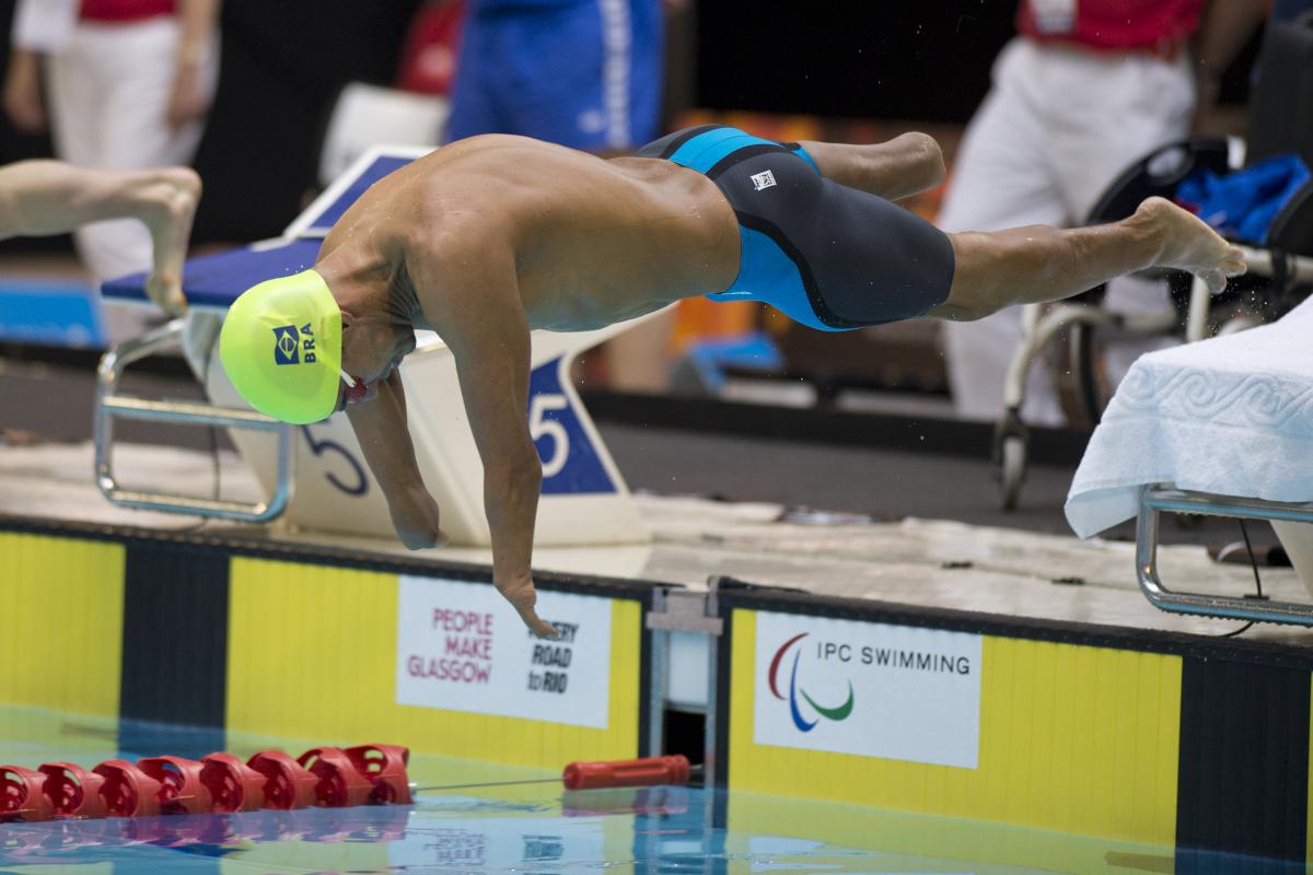 Dias Daniel - 2015 IPC Swimming World Championships Swimmer with yellow swimp cap jumps of the blocks.