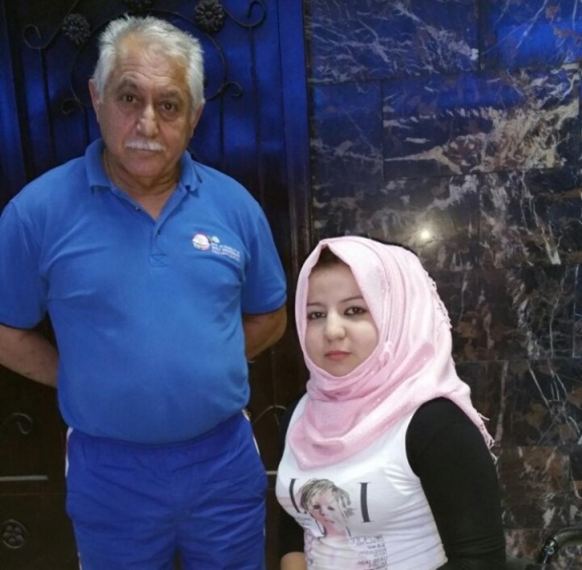 Zahraa Al-Maliki with her coach.