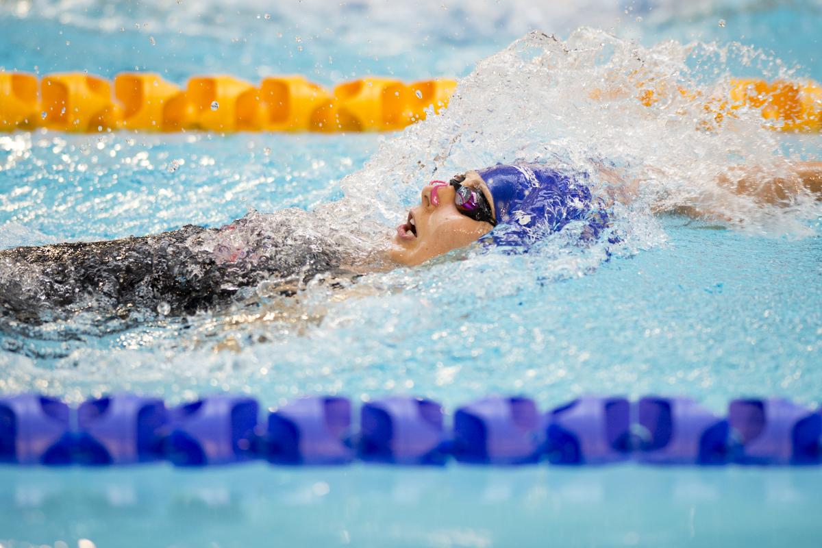 Swimmer doing backstroke in the water