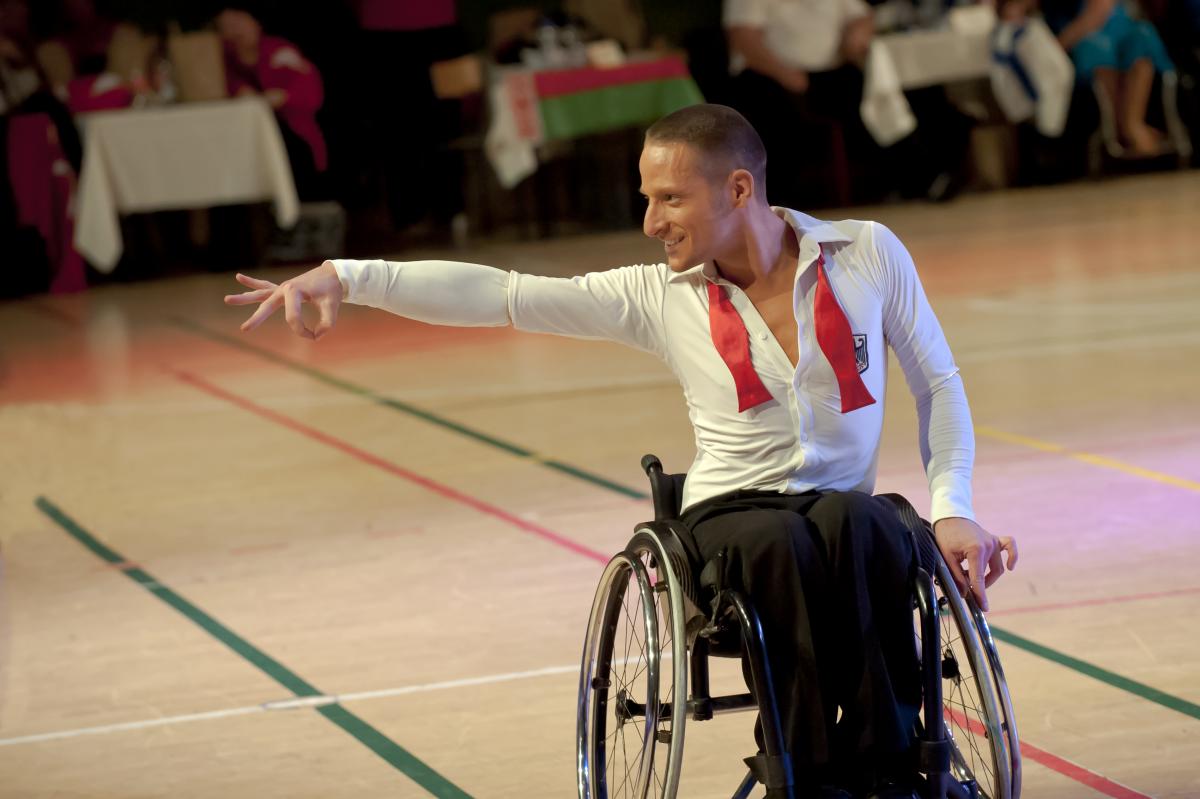 Erik Machens Germany wheelchair dance sport Man in wheelchair doing a dancing pose
