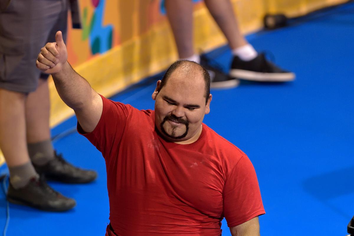 Jose Castillo Castillo gives a thumbs up to the audience after a competition 